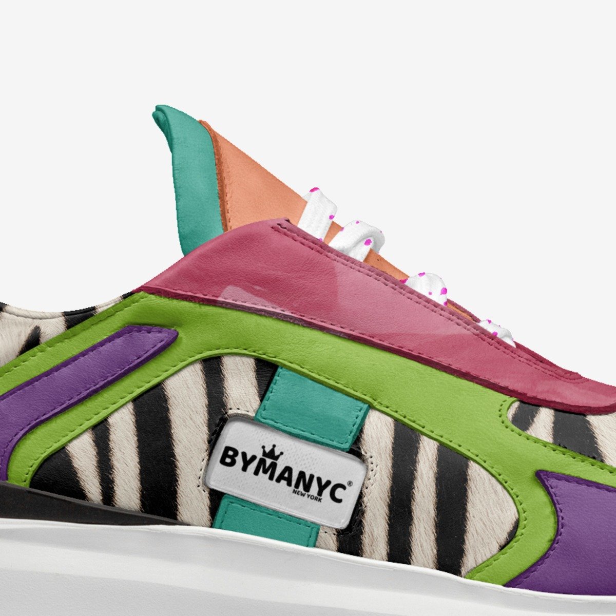 Colorful sneaker with zebra pattern and ByManyc logo on a white background