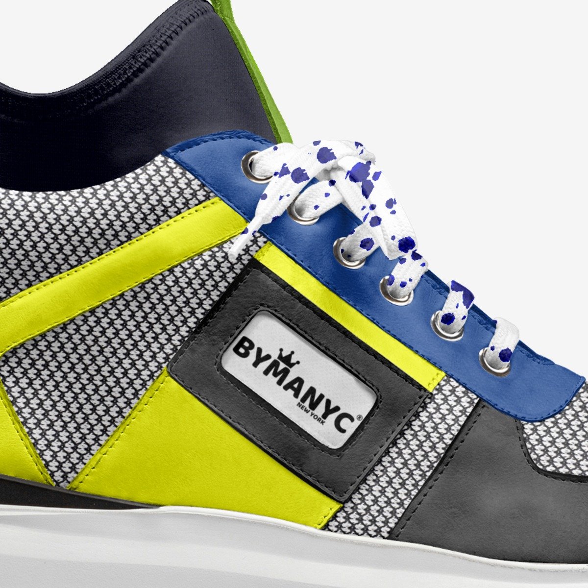 Close-up of a colorful sneaker with BYMANYC branding on a white background