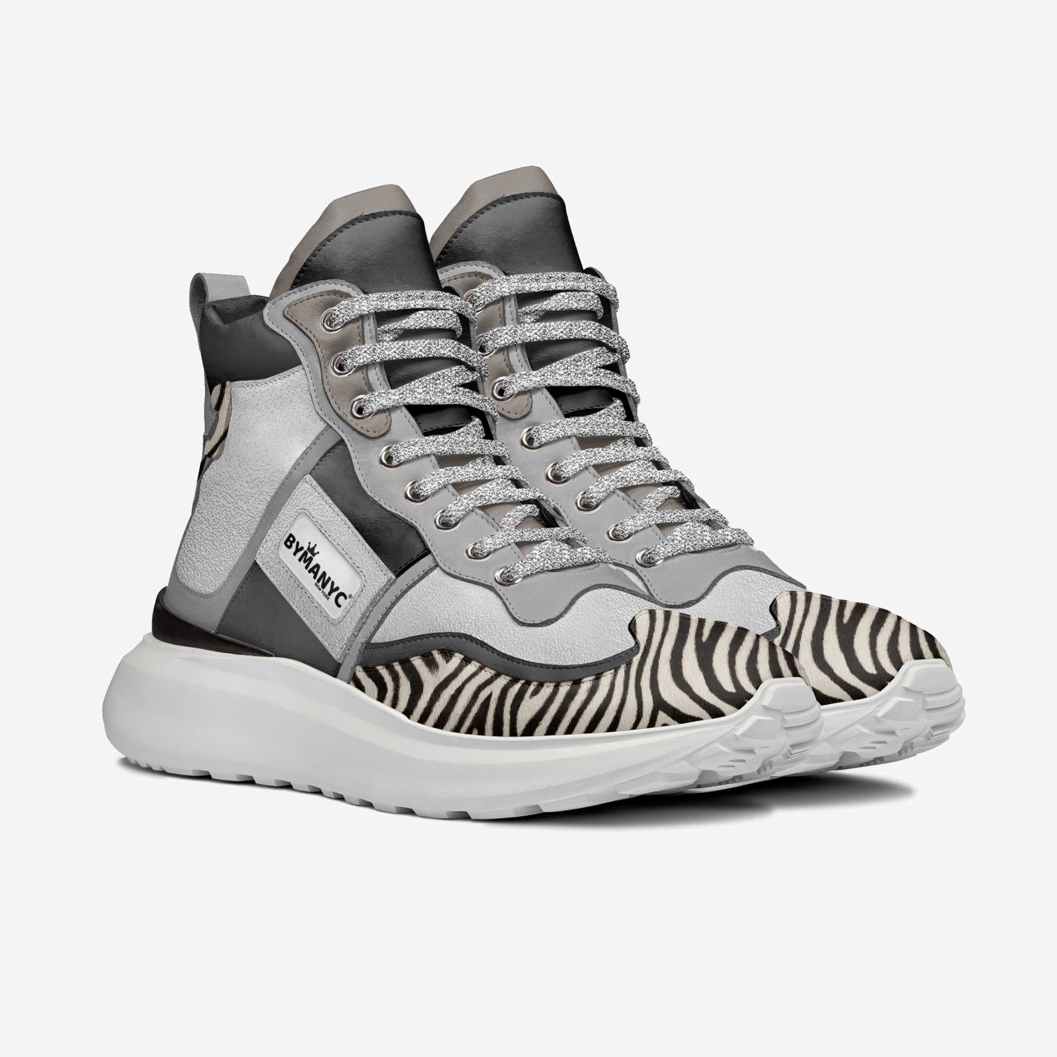 Gray and black high-top sneakers with zebra pattern sole on a white background
