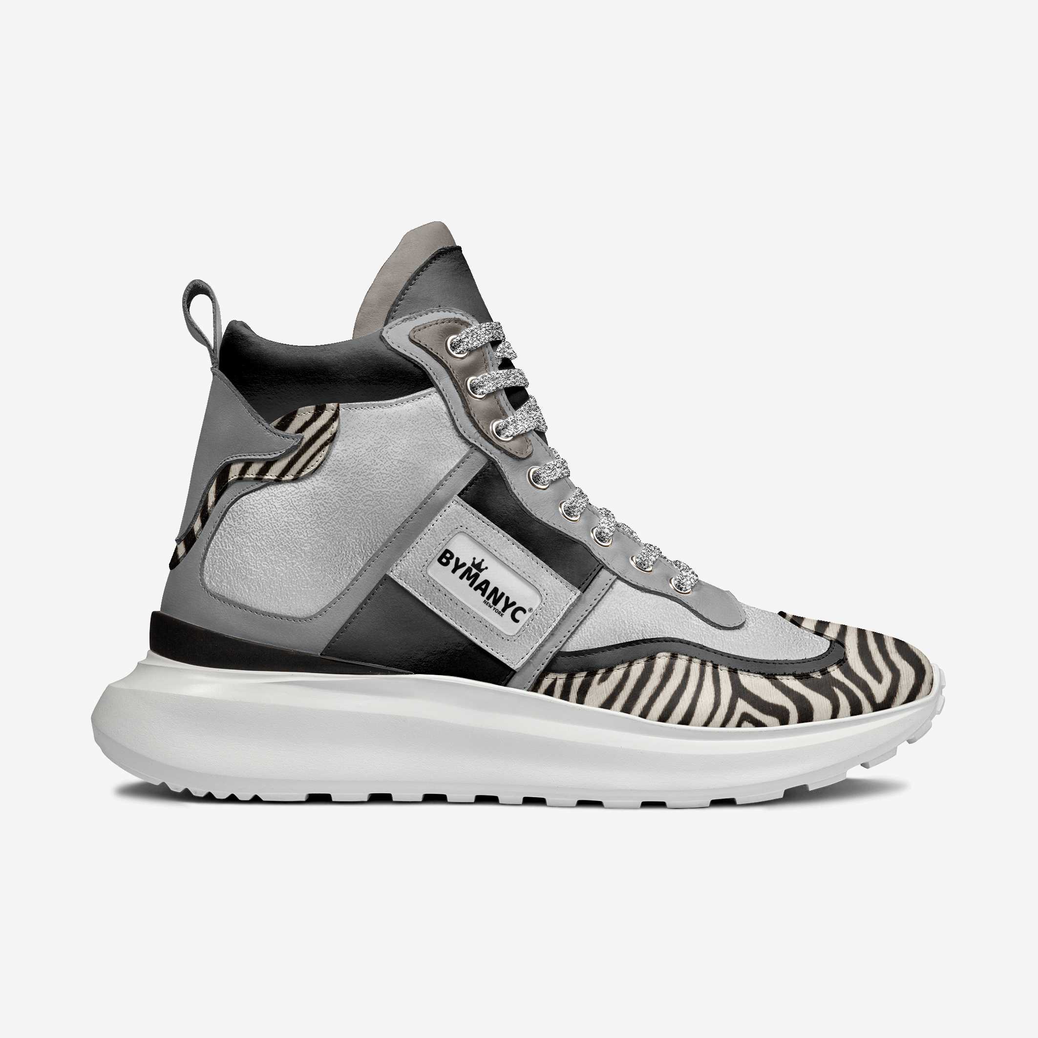Gray high-top sneaker with zebra pattern and 'BYBANYC' branding on a white background