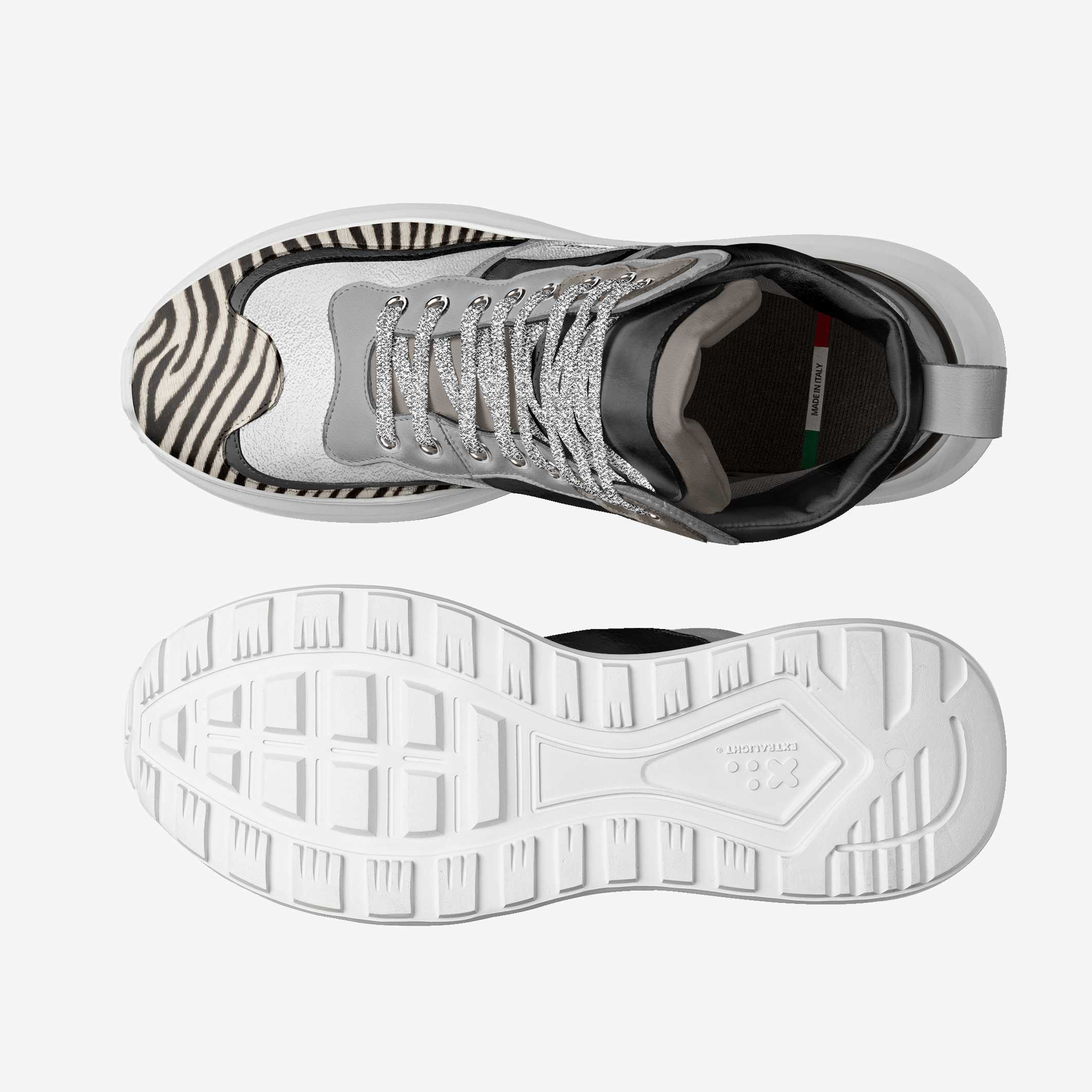 White sneaker with zebra pattern sole on a white background