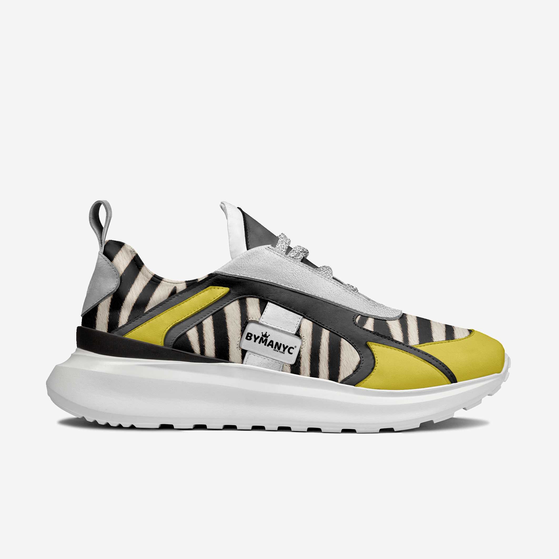 Sneaker with zebra pattern and yellow accents on a white background