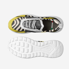 Sneaker with zebra pattern and yellow accents on a white background