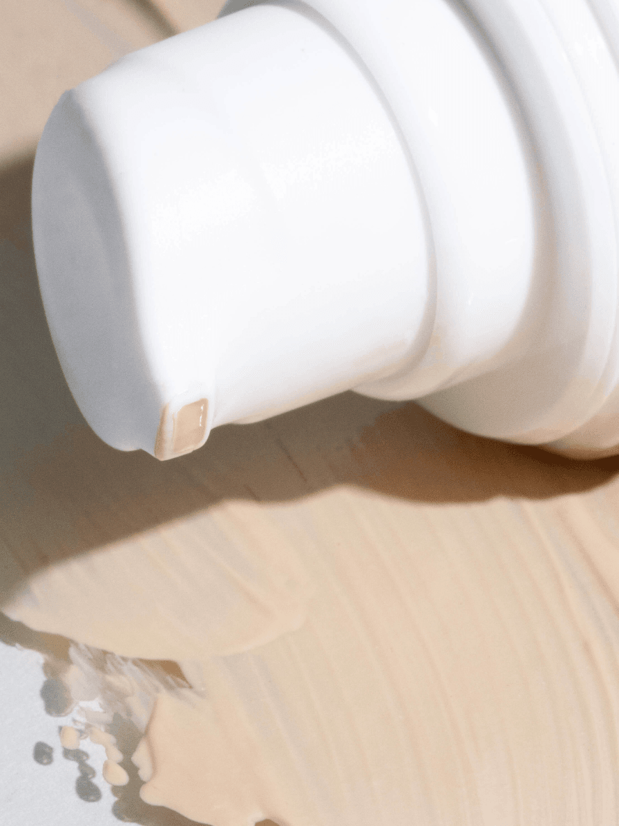 White ceramic vase on a wooden surface