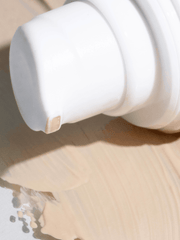 White ceramic vase on a wooden surface