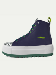 Navy high-top sneaker with green accents and white sole on a light gray background