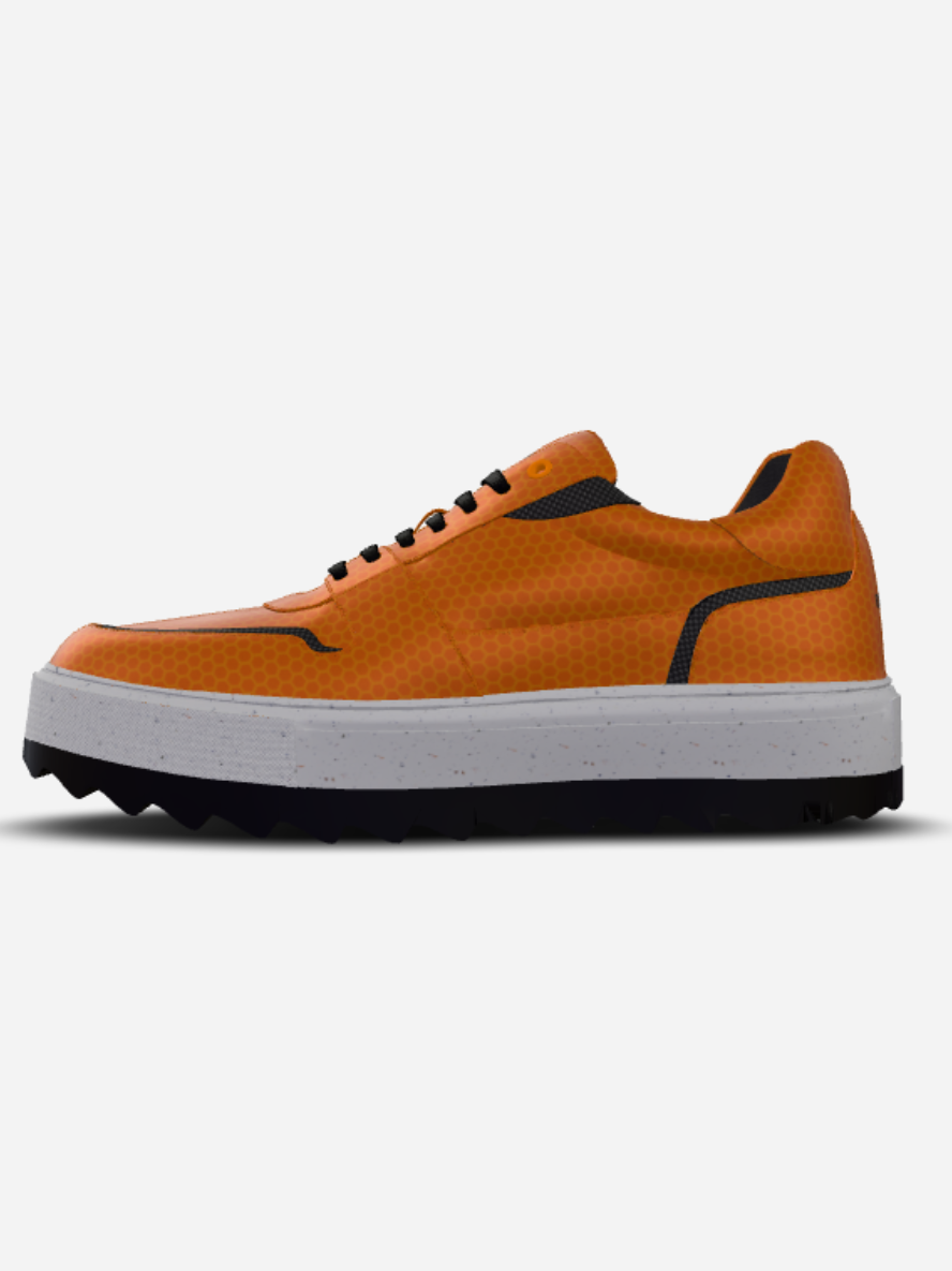 Orange sneaker with a white sole on a light gray background