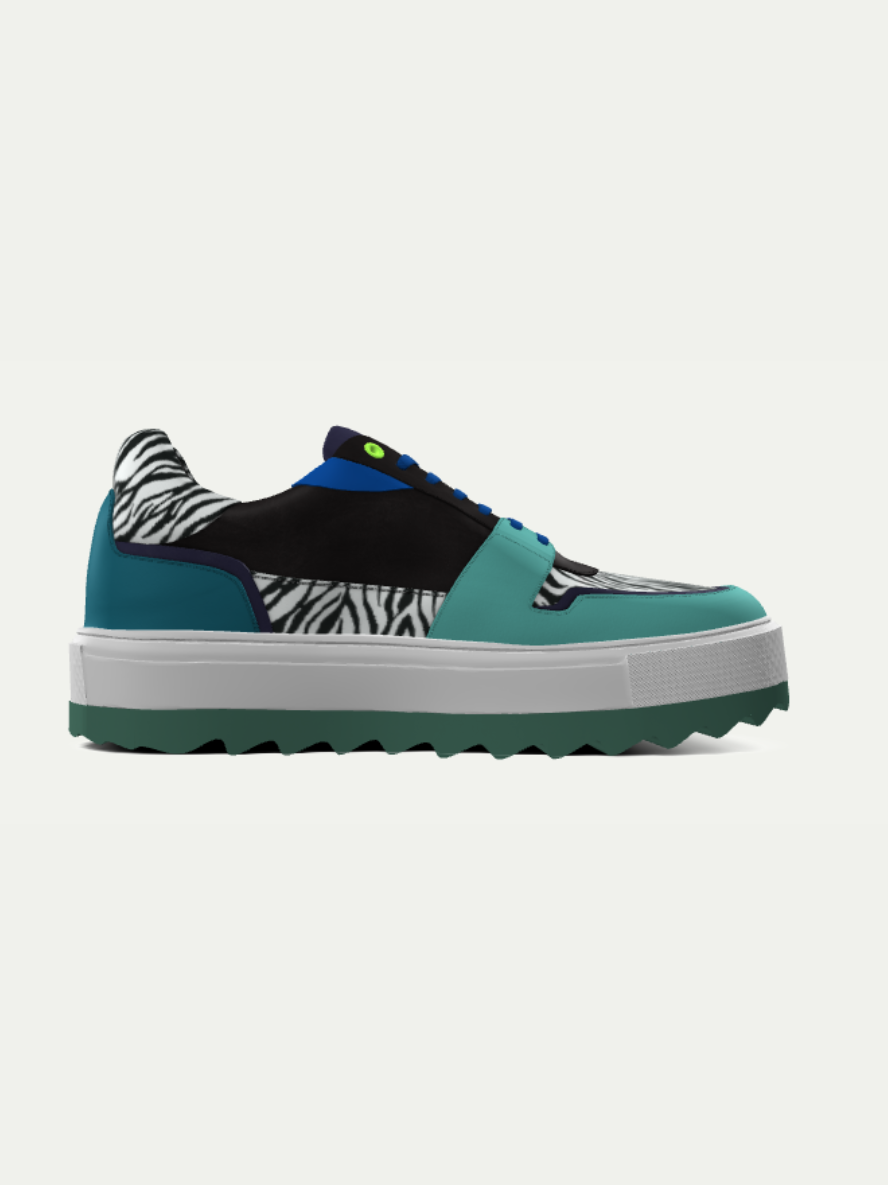 Teal sneaker with zebra pattern on a white background