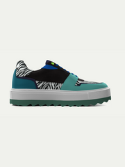 Teal sneaker with zebra pattern on a white background