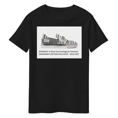 Black t-shirt with zebra-striped shoe graphic and text on a white background