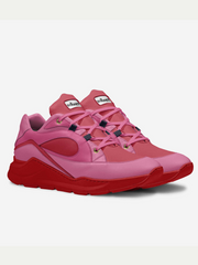 Pink and red sneaker with a brand logo on a white background