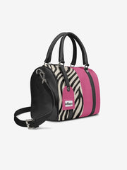 Handbag with zebra print and pink accents on a white background