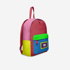 Colorful backpack with pink, blue, green, and yellow sections on a white background