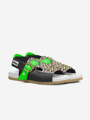 Black and green sandal with white sole on a white background
