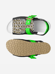 Sandal with zebra print strap and green accents on a white background