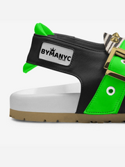 Black and green sneaker with 'BYMANYC' label on a white background