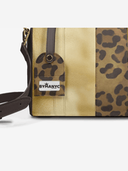 Leopard print and beige handbag with 'BY MANYC' label on a white background