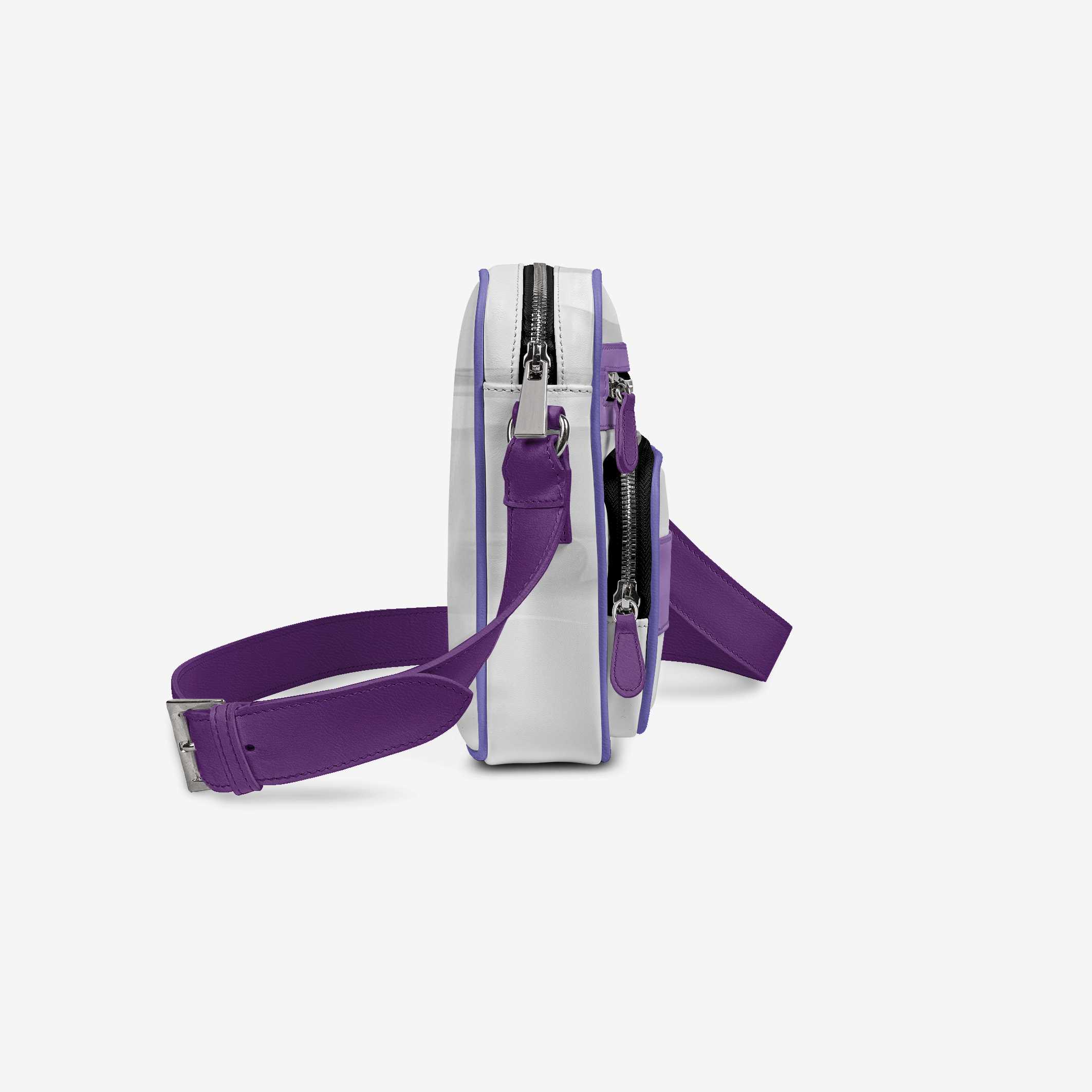 White crossbody bag with purple strap on a light gray background