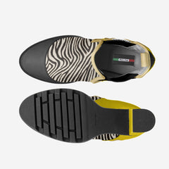 Top and side views of a shoe with zebra pattern and yellow sole on a white background