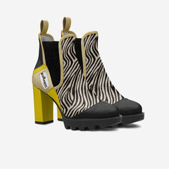Zebra print ankle boots with yellow heel on a white background
