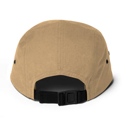 Beige cap with black strap on a white background