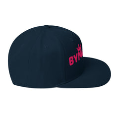 Navy blue cap with pink 'BYM' logo on a white background