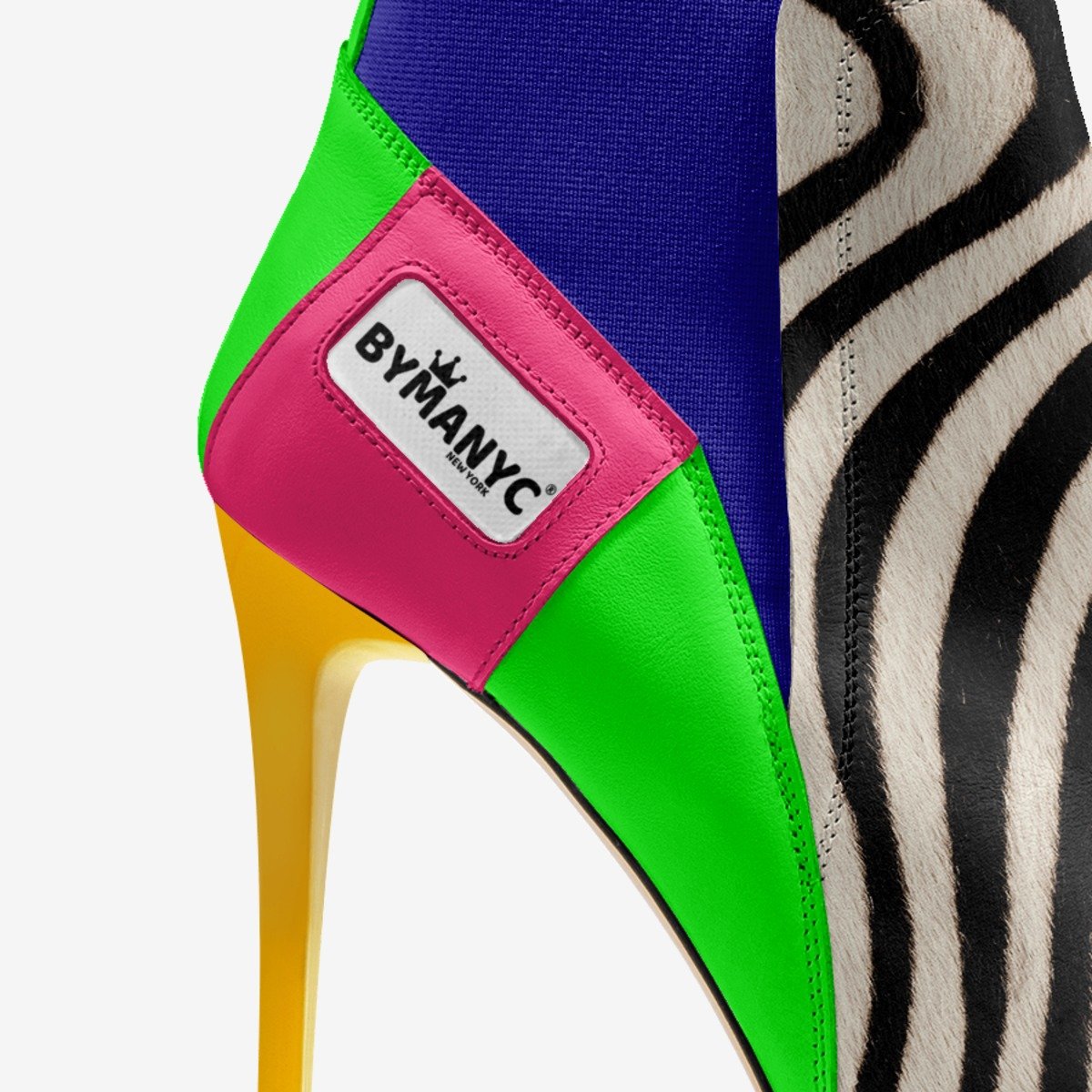 Colorful shoe with a ByManyc label on a white background