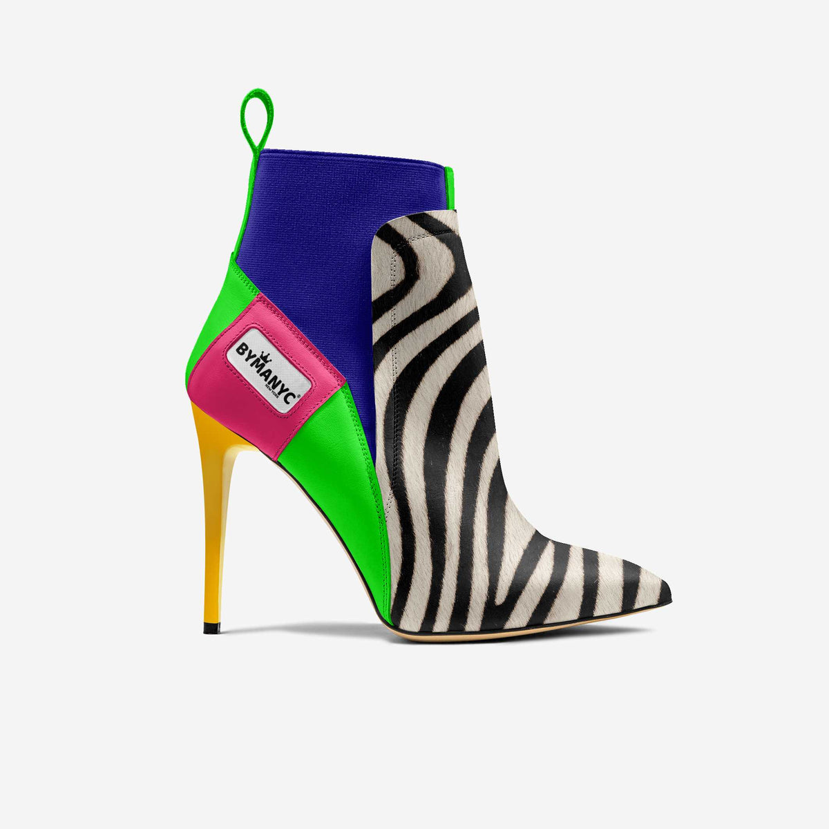 Colorful high-heeled shoe with zebra pattern and brand label on a white background