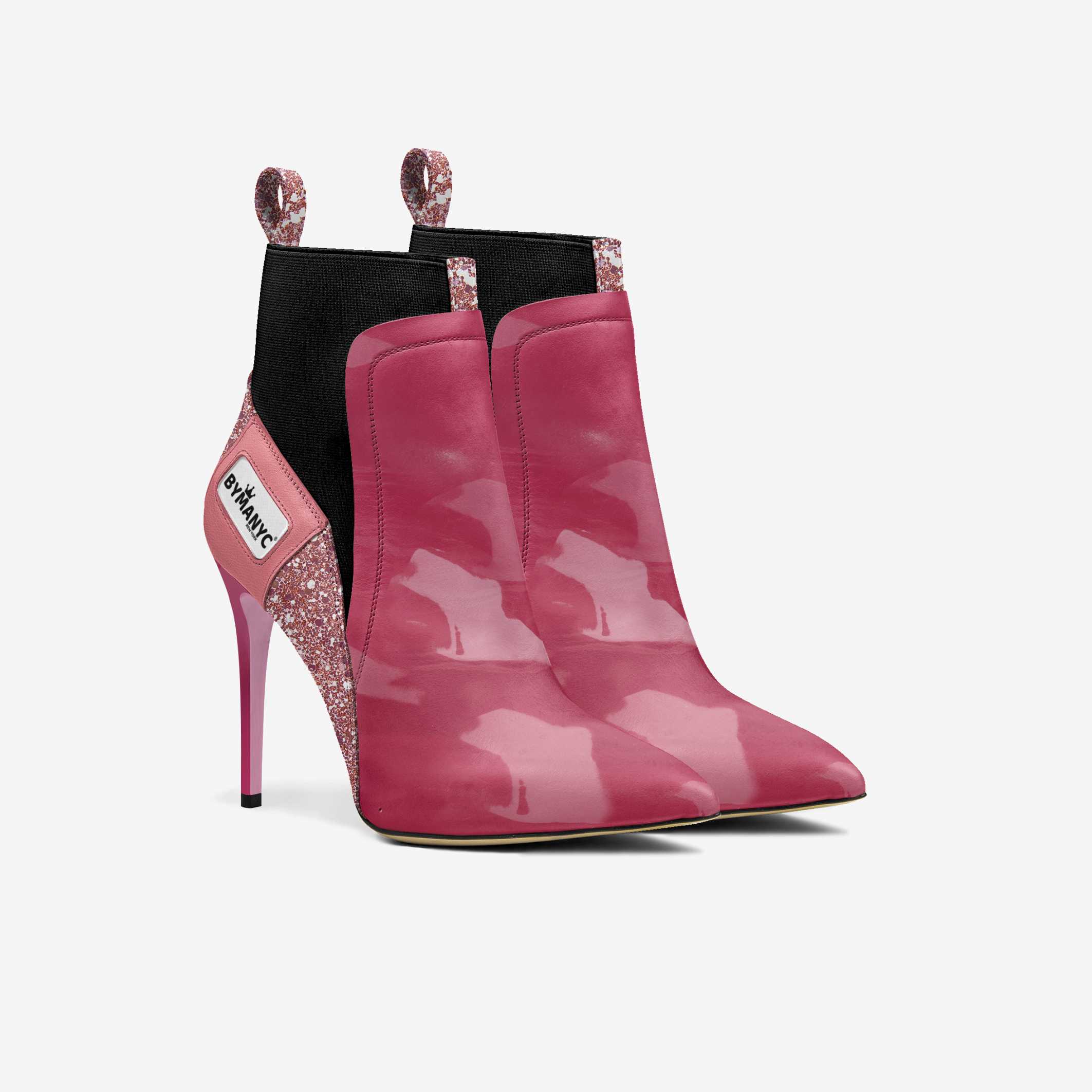 Pink high-heeled boots with glittery details on a white background
