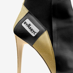 Close-up of a high-heeled shoe with 'B Yam NYC' label on a white background