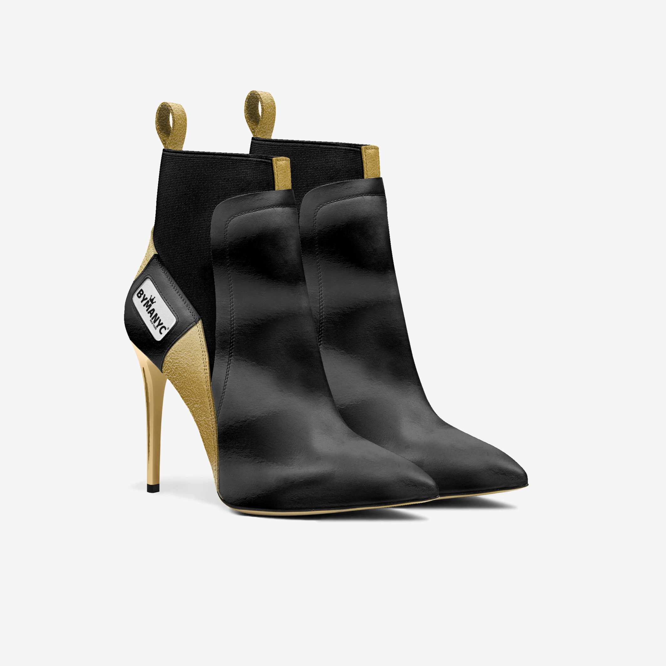 Black high-heeled ankle boots with gold accents on a white background