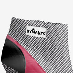 Black and pink shoe with a 'BY MANYC' label on a white background