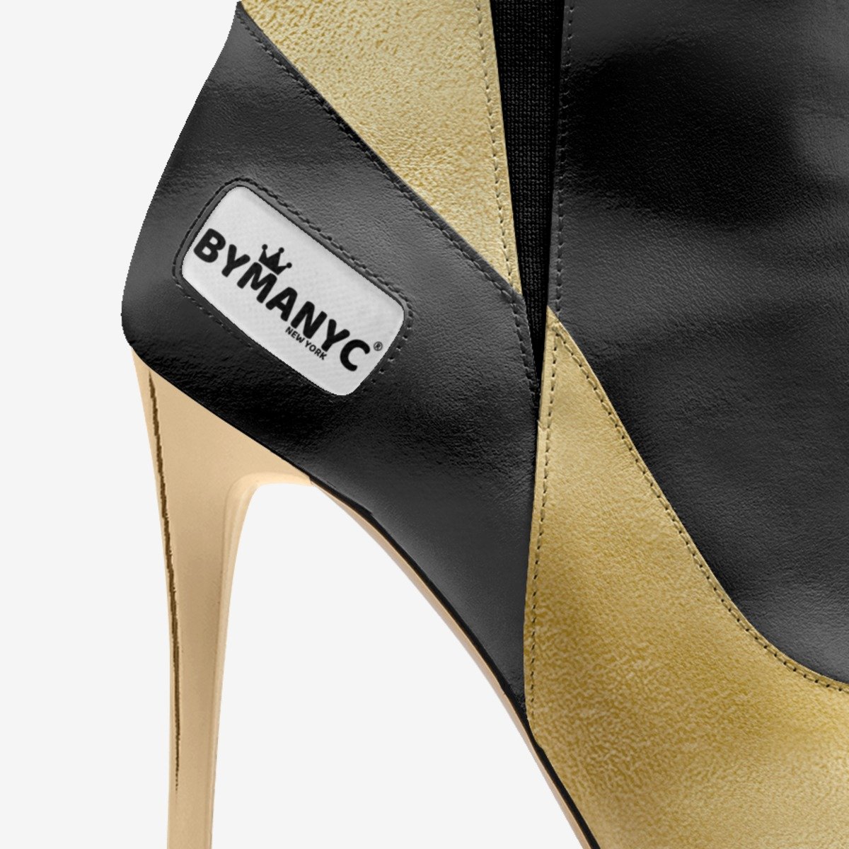High-heeled shoe with 'BYMANYC' label on a white background