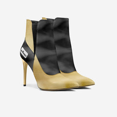 High-heeled ankle boot with black and beige design on a white background