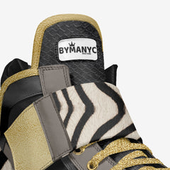 Close-up of a sneaker with zebra pattern and gold accents, featuring the BYMANYC New York logo.