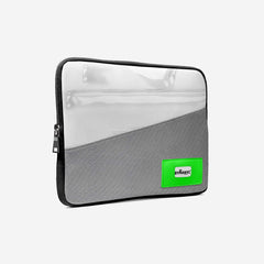 Gray laptop sleeve with a green label on a white background