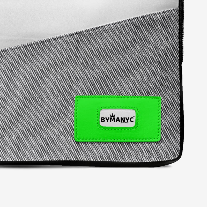 Gray bag with a green patch featuring 'BYMANYC' logo on a white background