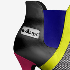 Close-up of a multicolored shoe with 'BYMANYC' branding on a white background