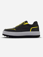 Black and yellow sneaker with a white sole on a light gray background