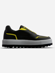 Black and yellow shoe with a white sole on a light gray background