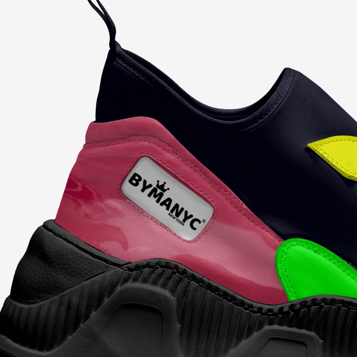 Colorful sneaker with 'BYMANYC' logo on a white background