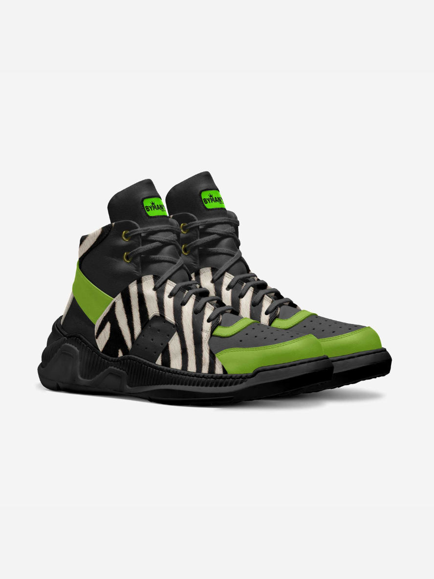 Pair of high-top sneakers with zebra pattern and green accents on a light gray background