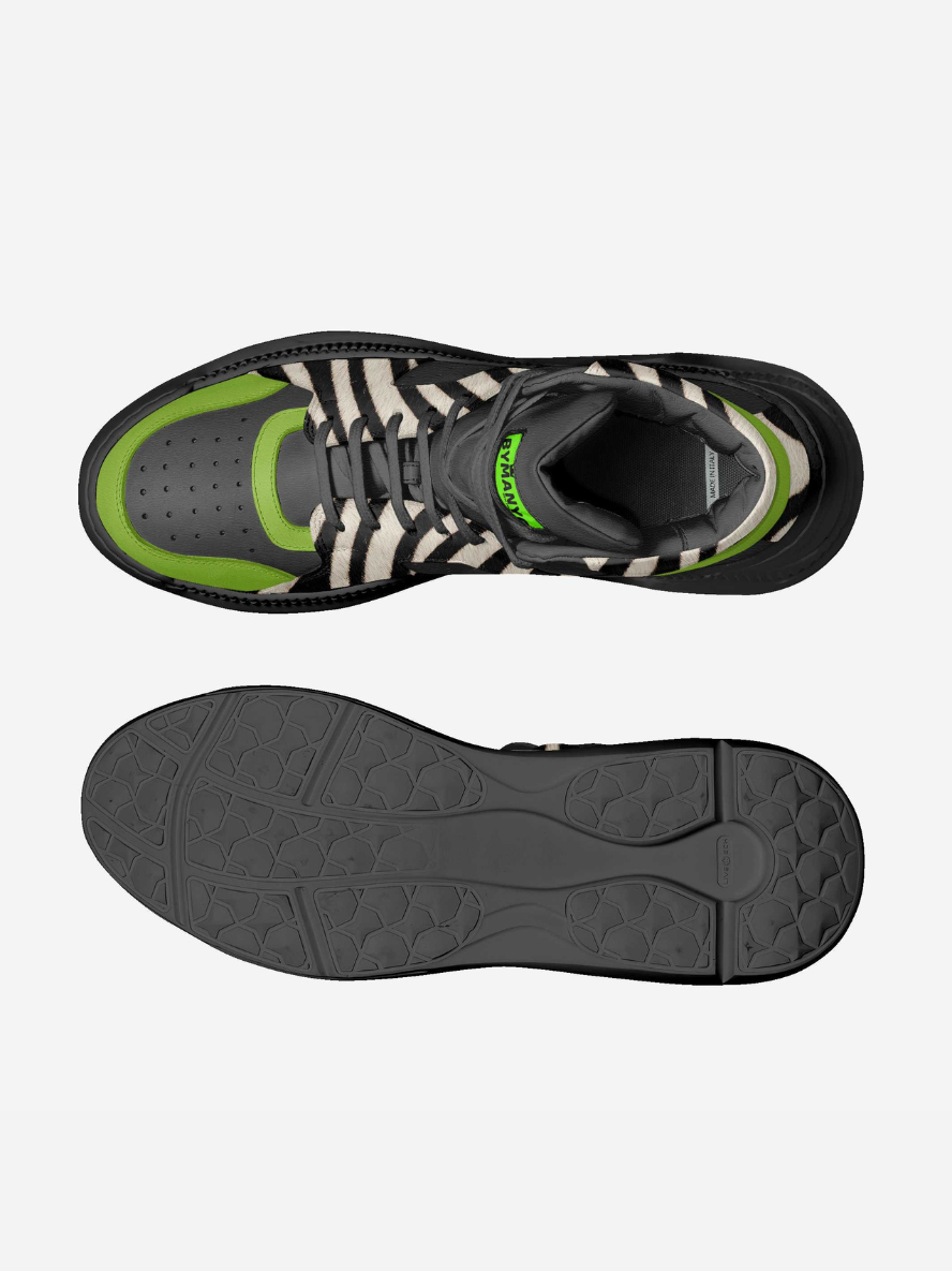 Black and green athletic shoe with zebra pattern on a white background