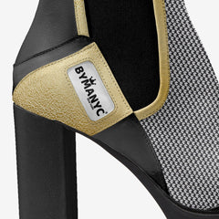 Black high-heeled shoe with beige heel cup and ByManyc label on a white background