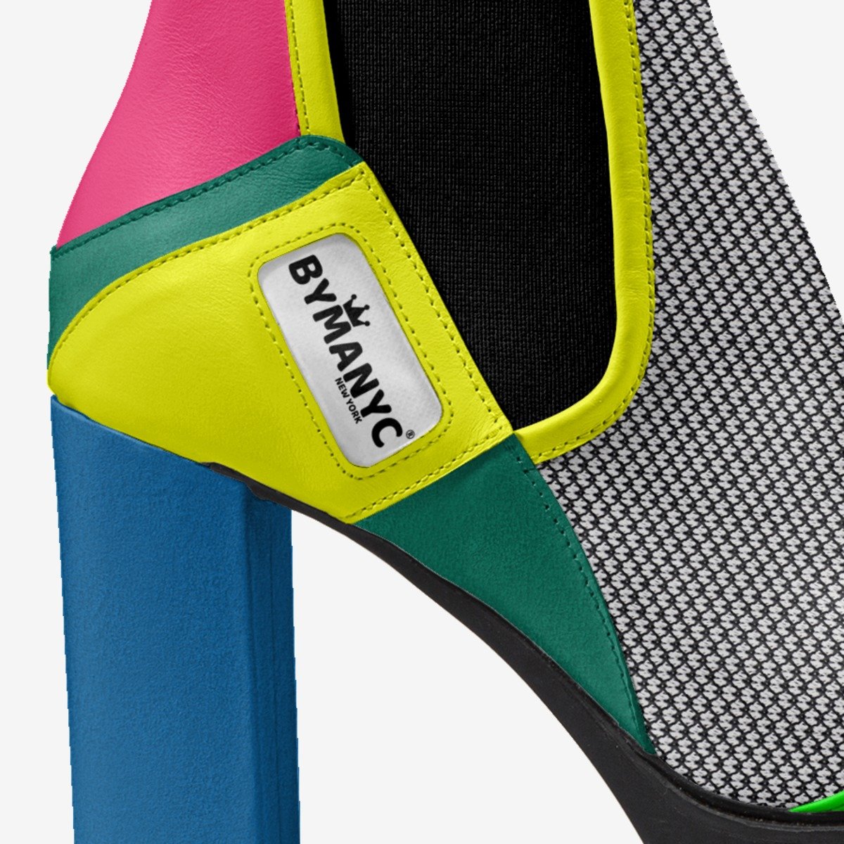 Colorful pet carrier with 'BYMANYC' logo on a white background