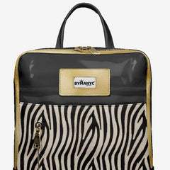 Backpack with zebra pattern and By Many brand label on a light gray background