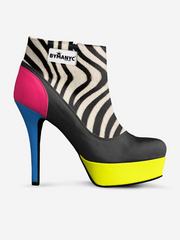 High-heeled shoe with zebra pattern and colorful platform on a white background
