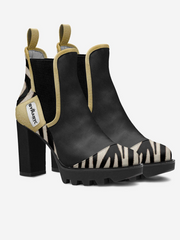 Black and zebra-patterned high-heeled boots on a white background