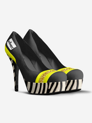 Black high-heeled shoes with zebra pattern and yellow accents on a white background