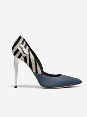 High-heeled shoe with zebra pattern and blue sole on a white background
